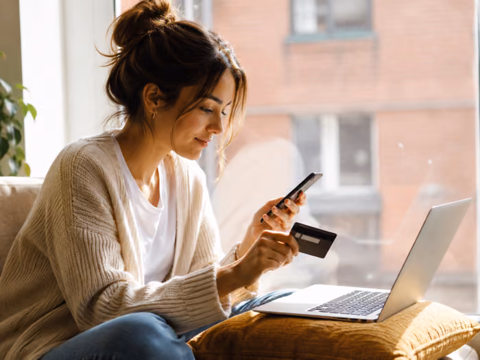 Woman paying online with a card